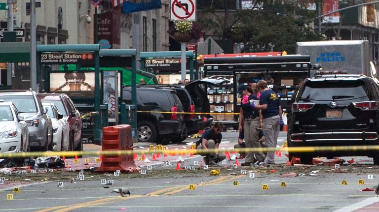 FBI agents review the crime scene on W. 23rd Street in Manhattan's Chelsea neighborhood on Sept. 18, 2016.