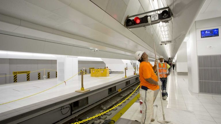 Workers paint on Platform A. 