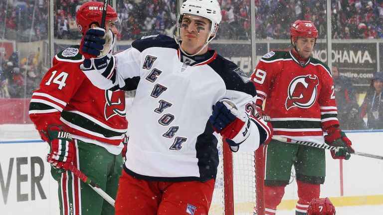 NEW YORK, NY - JANUARY 26: (EDITORIAL USE ONLY) Chris Kreider #20 celebrates a second period goal by Rick Nash #61 of the New York Rangers against the New Jersey Devils during the 2014 Coors Light NHL Stadium Series at Yankee Stadium on January 26, 2014 in the Bronx borough of New York City. (Photo by Bruce Bennett/Getty Images)