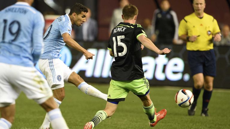 New York City FC vs. Sounders 23 New York City FC midfielder Mehdi Ballouchy (20) scores a second-half goal in an MLS game at Yankee Stadium on Sunday, May 3, 2015.
