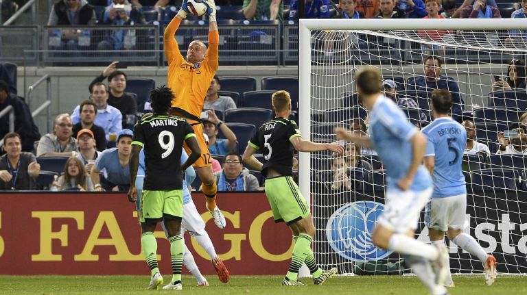 New York City FC vs. Sounders 28 New York City FC goalkeeper Josh Saunders (12) leaps to make a save in an MLS game against the Seattle Sounders FC at Yankee Stadium on Sunday, May 3, 2015.