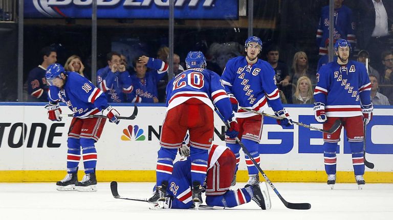 Members of the New York Rangers look on after the Washington Capitals scored a goal in the final second of Game 1 of the Eastern Conference semifinals at Madison Square Garden on Thursday, April 30, 2015.