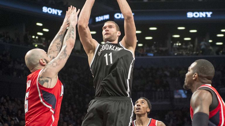 Brooklyn Nets' Brook Lopez shoots over Pero Antic of the Atlanta Hawks in the fourth quarter during Game 3 of the Eastern Conference quarterfinals at Barclays Center on Saturday, April 25, 2015.