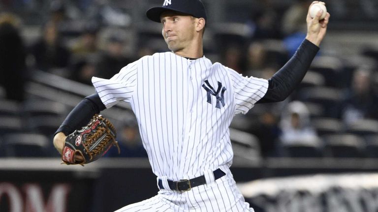 New York Yankees relief pitcher Chasen Shreve delivers against the New York Mets in a baseball game at Yankee Stadium on Friday, April 24, 2015.