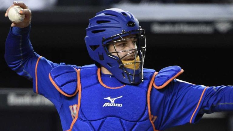 Mets catcher Kevin Plawecki warms up relief pitcher Hansel Robles in the seventh inning against the Yankees at Yankee Stadium on Friday, April 24, 2015.