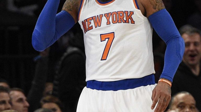 New York Knicks forward Carmelo Anthony reacts after sinking a three-pointer against the New Orleans Pelicans in the first half of an NBA game at Madison Square Garden on Monday, Jan. 19, 2015.
