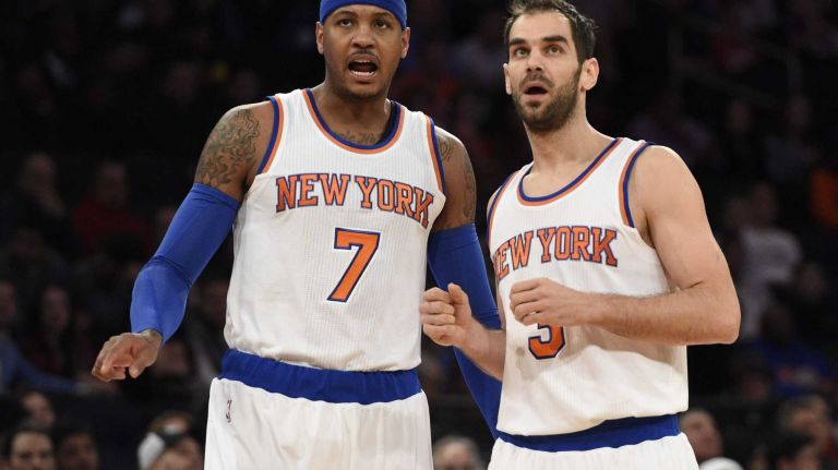 New York Knicks forward Carmelo Anthony and guard Jose Calderon look on during a foul shot by New Orleans Pelicans guard Eric Gordon in the first half of an NBA game at Madison Square Garden on Monday, Jan. 19, 2015.
