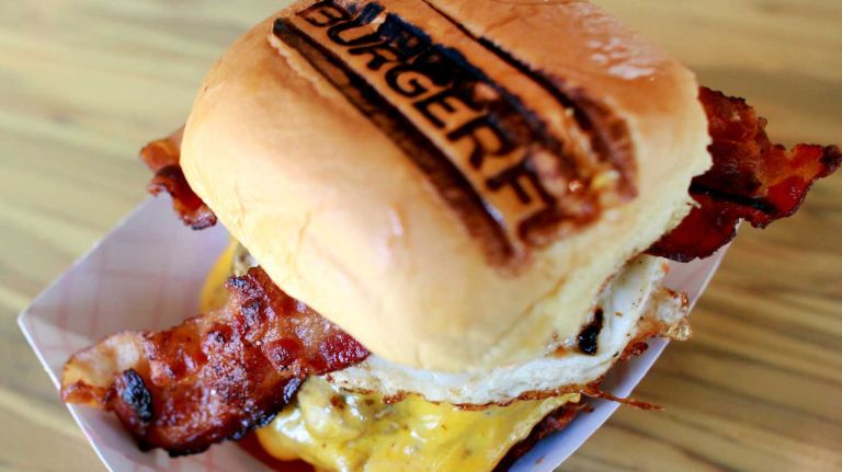 NYC burger chains: Where the out-of-towners came from 5 John Rosatti opened the first BurgerFi in Fort Lauderdale, Florida in 2011, offering a fast-casual, eco-friendly setting and natural ingredients. It has since expanded all the way to the West Coast, and boasts a NYC location on the Upper East Side.