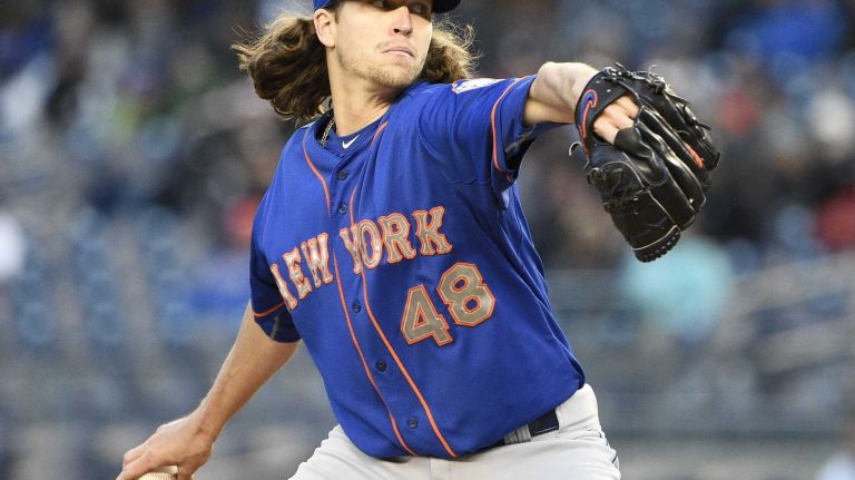 New York Mets starting pitcher Jacob deGrom delivers in the first inning against the New York Yankees in a baseball game at Yankee Stadium on Friday, April 24, 2015.