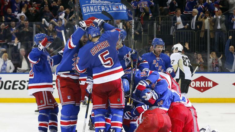 The New York Rangers celebrate their overtime goal against the Pittsburgh Penguins during Game 5 of the Eastern Conference Quarterfinals scored by Carl Hagelin at Madison Square Garden on Friday, April 24, 2015.