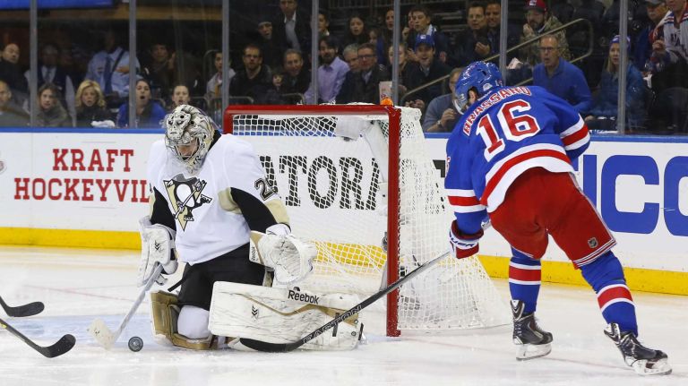 Marc-Andre Fleury of the Pittsburgh Penguins makes a second-period save against Derick Brassard of the New York Rangers during Game 5 of the Eastern Conference Quarterfinals at Madison Square Garden on Friday, April 24, 2015.