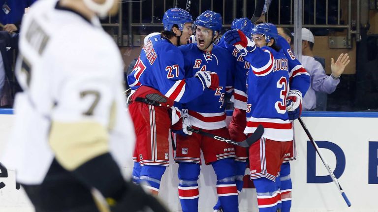 Derick Brassard of the New York Rangers celebrates his first- period goal against the Pittsburgh Penguins with teammates during Game 1 of the Eastern Conference Quarterfinals at Madison Square Garden on Thursday, April 16, 2015.