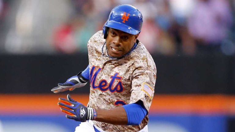 Curtis Granderson of the Mets rounds second base to score a first-inning run on a double by teammate Daniel Murphy against the Philadelphia Phillies at Citi Field on Monday, July 28, 2014.