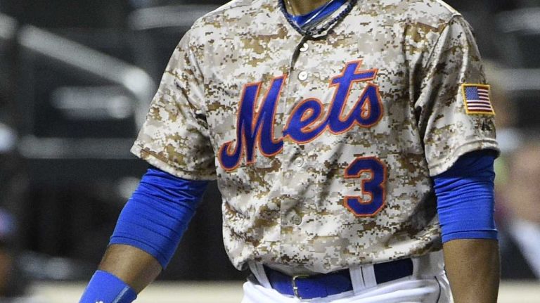New York Mets right fielder Curtis Granderson reacts after he struck out looking against the Colorado Rockies to end the sixth inning of an MLB baseball game at Citi Field on Monday, September 8, 2014.