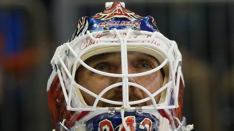 Henrik Lundqvist of the New York Rangers shows the effects of being interferered with by Mika Zibanejad of the Ottawa Senators during the first period at Madison Square Garden on Thursday, April 9, 2015.