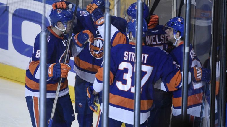 The New York Islanders celebrate a goal by New York Islanders center Frans Nielsen against the Los Angeles Kings in the second period of an NHL hockey game at Nassau Coliseum on Thursday, March 26, 2015.