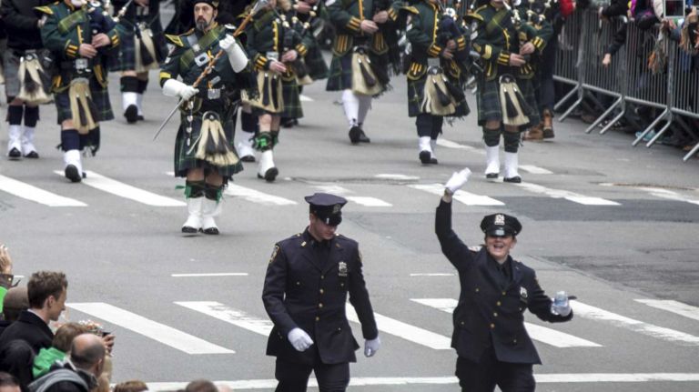 Marchers walk through 5th Avenue during the St. Patrick's Day Parade in New York on March 17, 2015.