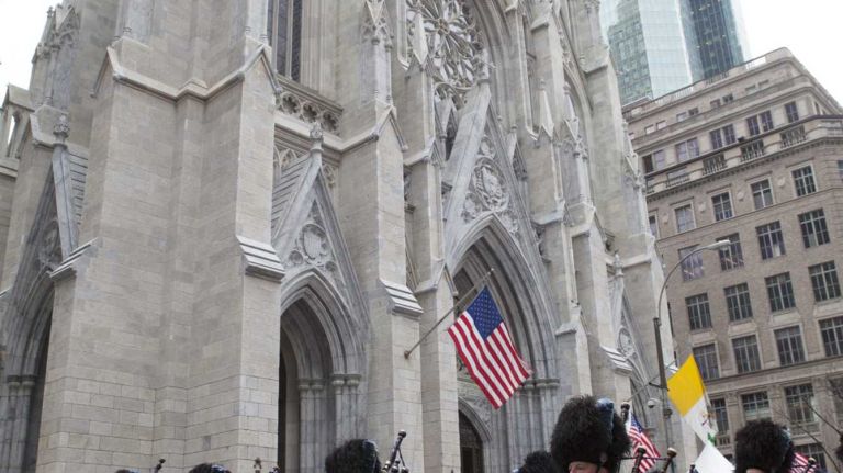 Participants march in front of St. Patrick's Cathedral during the 245th Annual Saint Patrick's Day Parade along Fifth Avenue in Manhattan Tuesday, March 17, 2015.