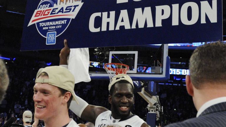 Villanova Wildcats forward Daniel Ochefu celebrates after Villanova defeated Xavier 69-52 to win the Big East basketball championship at Madison Square Garden on Saturday, March 14, 2015.