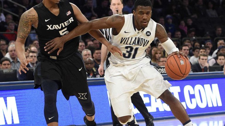 Villanova Wildcats guard Dylan Ennis drives the ball against Xavier Musketeers forward Trevon Bluiett during the final game of the Big East basketball tournament at Madison Square Garden on Saturday, March 14, 2015.