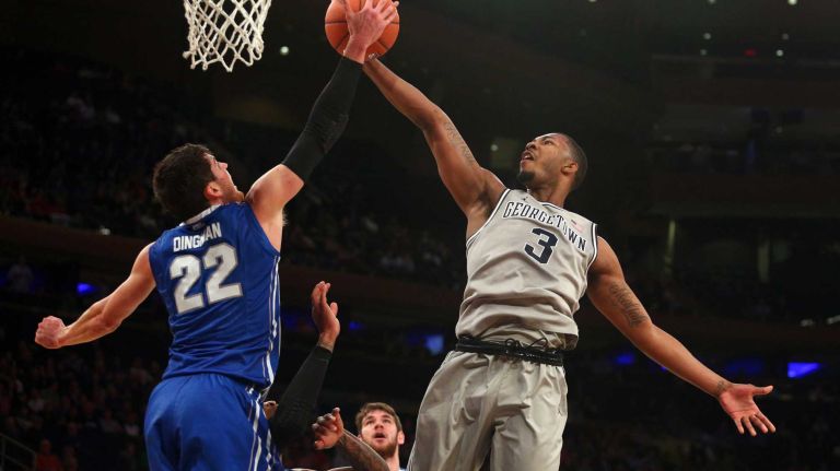 Creighton Bluejays guard Avery Dingman blocks a layup by Georgetown Hoyas forward Mikael Hopkins during the first half of a Big East Tournament game at Madison Square Garden on Thursday, March 12, 2015.