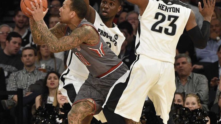 Big East Tournament quarterfinal: St. John's vs. Providence 22 St. John's Red Storm guard D'Angelo Harrison splits his defenders Providence Friars forward Ben Bentil and forward LaDontae Henton, but misses his shot in a Big East quarterfinal men's basketball game at Madison Square Garden on Thursday, March 12, 2015.