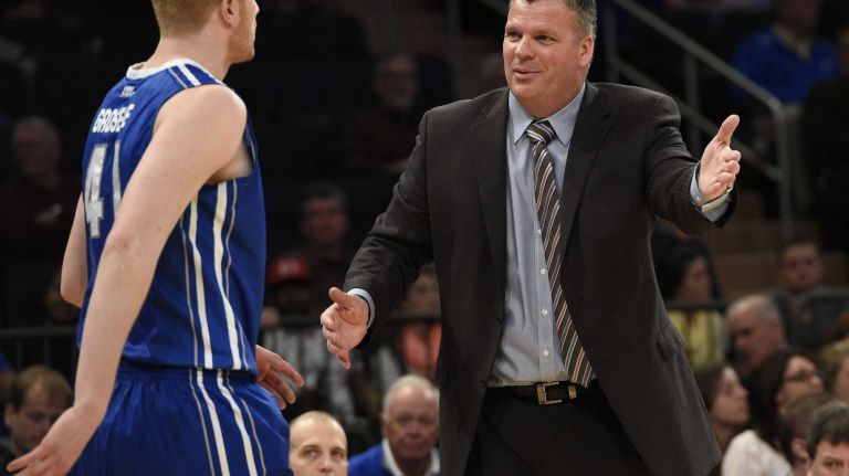 Creighton Bluejays head coach Greg McDermott directs Creighton Bluejays center Geoffrey Groselle against the DePaul Blue Demons in the first round of the Big East basketball tournament at Madison Square Garden on Wednesday, March 11, 2015. 