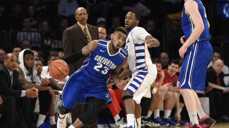 Creighton Bluejays guard James Milliken dribbles past DePaul Blue Demons guard Durrell McDonald in the first round of the Big East basketball tournament at Madison Square Garden on Wednesday, March 11, 2015. 