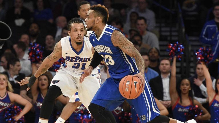 Creighton Bluejays guard James Milliken dribbles against DePaul Blue Demons forward Jamee Crockett in the first round of the Big East basketball tournament at Madison Square Garden on Wednesday, March 11, 2015. 
