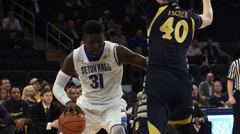 Big East Tournament first round: Marquette vs. Seton Hall 48 Seton Hall Pirates forward Angel Delgado drives the ball against Marquette Golden Eagles center Luke Fischer in the first round of the Big East basketball tournament at Madison Square Garden on Wednesday, March 11, 2015.
