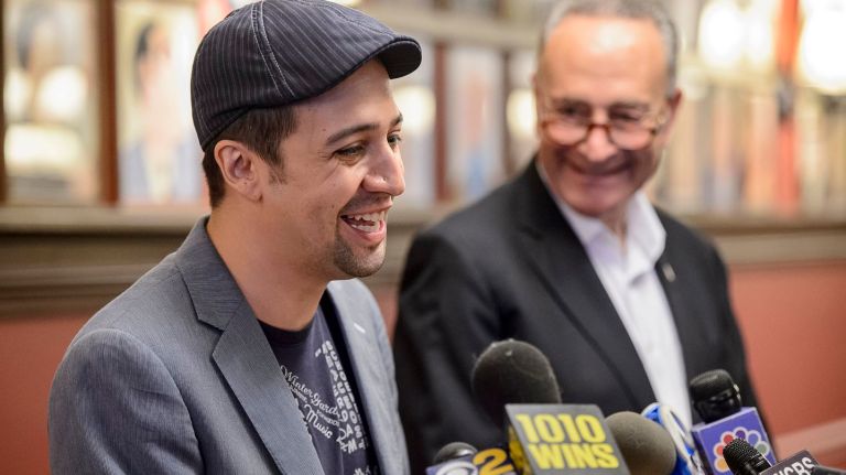 Lin-Manuel Miranda speaks, as Sen. Charles Schumer looks on, during a press conference at Sardi's on West 44th Street to announce Federal legislation to address cyber-scalping, Sunday, Aug. 14, 2016.