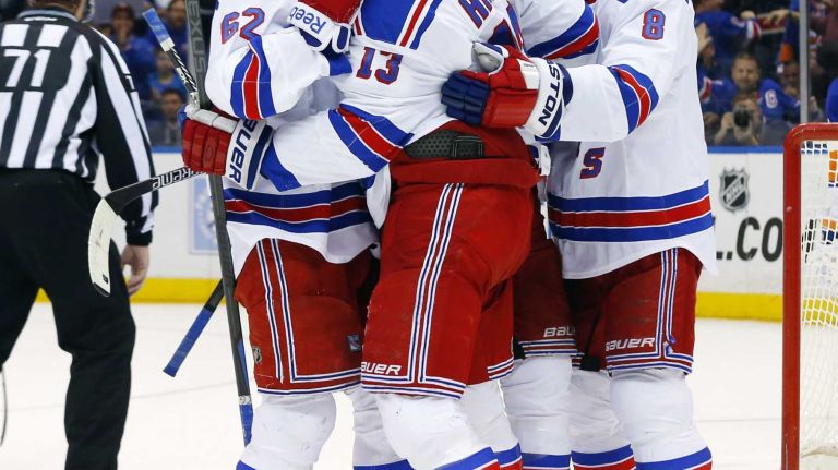 Kevin Hayes of the New York Rangers celebrates his second-period goal against the New York Islanders with his teammates at Nassau Coliseum on Tuesday, March 10, 2015.