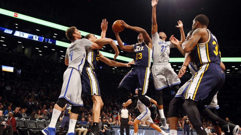 Brooklyn Nets vs. Utah Jazz 51 Elijah Millsap #13 of the Utah Jazz goes to the hoop against Markel Brown #22 of the Brooklyn Nets at Barclays Center on Sunday, Mar. 8, 2015 in Brooklyn, New York.