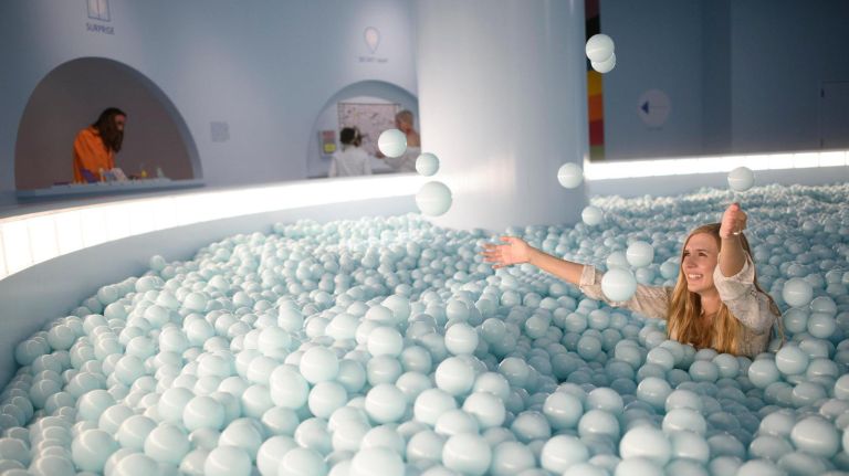 Inside the Color Factory NYC, a vibrant pop-up that lights up your inner child 18 Inspired by the blue sky, the exhibit's huge ball pit, which is so in fashion right now, is filled with 50,000 anti-bacterial balls. You can play around like a child, have your photo taken as you sink down and then pick up some free gelato, trinkets and a color map to the city.