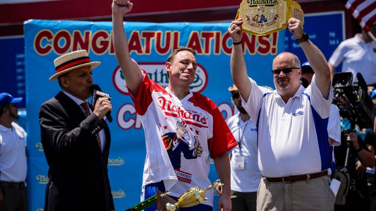 Nathan's Hot Dog Eating Contest 2017: Photos from the Coney Island event 22 Joey Chestnut accepts his trophy after winning Nathan's Famous Hot Dog Eating Contest men's title in Coney Island on Tuesday, July 4, 2017.