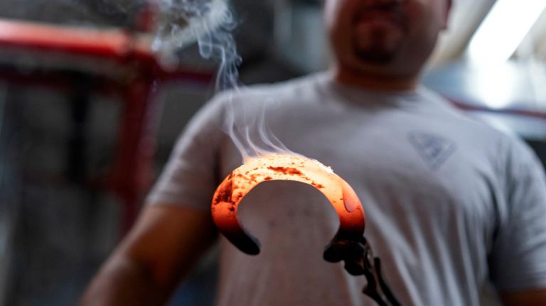 Martinez adjusts the shoe.