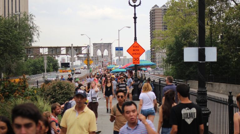 To address a surge in visitors to the Brooklyn Bridge, the city is launching a seven-month study to determine if the cycling and pedestrian paths could be widened.