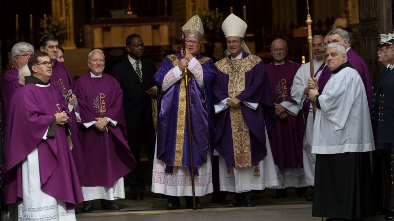 Cardinal Timothy Dolan started the funeral proceedings for the FDNY's Michael R. Davidson at St. Patrick's Cathedral shortly after 10:30 a.m. on Tuesday.