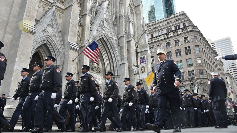 Firemen and mourners arrive for the funeral for fireman Michael Davidson at St. Patrick's Cathedral Tuesday.