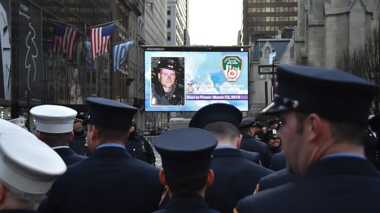 Firemen and mourners arrive for the funeral for fireman Michael Davidson at St. Patrick's Cathedral Tuesday.