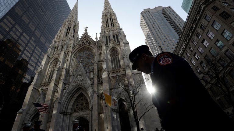 Members of the FDNY arrive at St. Patrick's Cathedral for firefighter Michael Davidson's funeral mass on Tuesday.