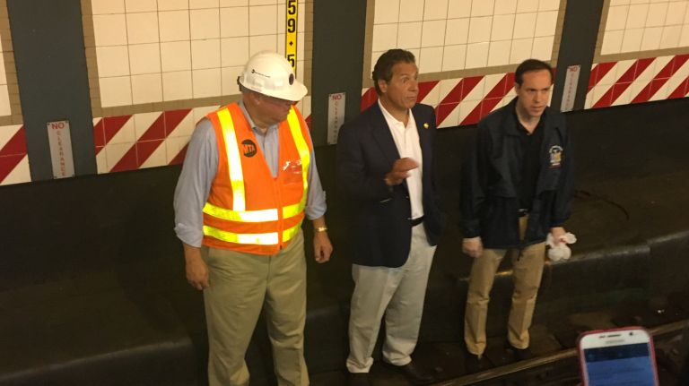 MTA Chairman Thomas Prendergast (left) and Gov. Andrew Cuomo (center) announce new mosquito fighting tactics to prevent the proliferation of the Zika virus.