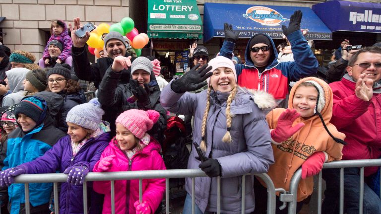 The crowd that turned out to see the 90th annual Macy's Thanksgiving Day Parade was estimated at 3.5 million, about the same number as last year. These spectators were at Sixth Avenue and 59th Street.