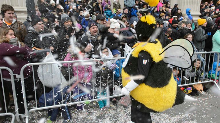 Spectators throw confetti at a performer on Thursday, Nov. 24, 2016, during the 90th Macy's Thanksgiving Day Parade in Manhattan.
