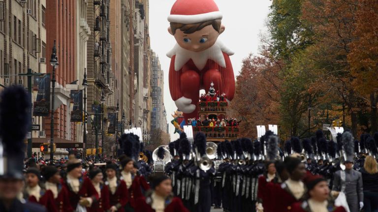 The Elf on the Shelf balloon floats above Central Park West on Thursday, Nov. 24, 2016, at the start of the 90th Macy's Thanksgiving Day Parade in Manhattan.