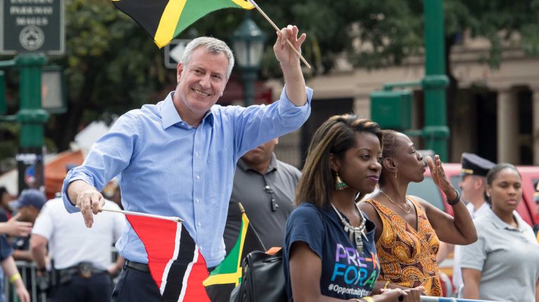 Mayor Bill de Blasio and his wife, Chirlane McCray, seen blowing a kiss, march in the West Indian Day Parade along Eastern Parkway in Brooklyn on Monday, Sept. 5, 2016. 