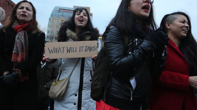 Women take part in the International Women's Strike and rally in Washington Square Park, coinciding with International Women's Day, on Thursday, Mar. 8, 2018.