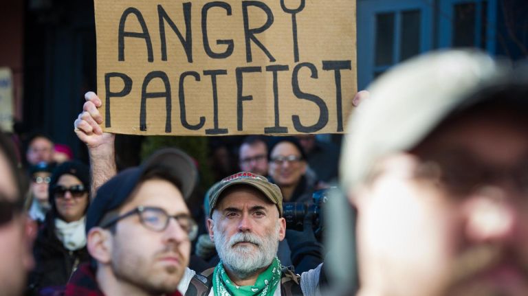 People protest at a rally in front of the Stonewall Inn in solidarity with immigrants, asylum seekers, refugees and the LGBT community on Saturday, Feb. 4, 2017, in Manhattan. 
