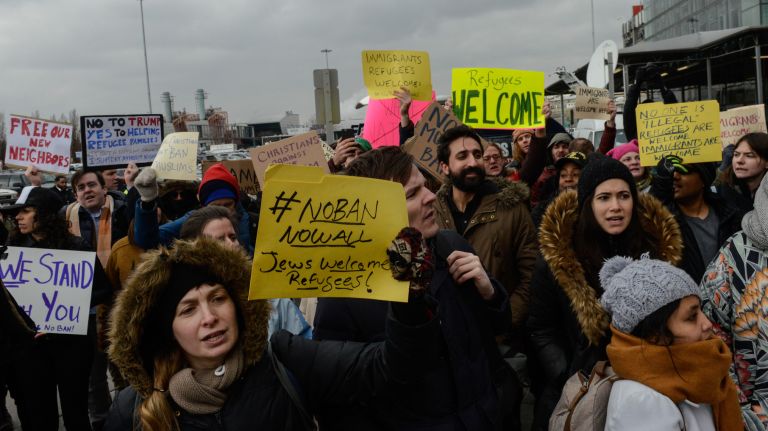 Protesters at Kennedy Airport as the travel ban goes into effect. 