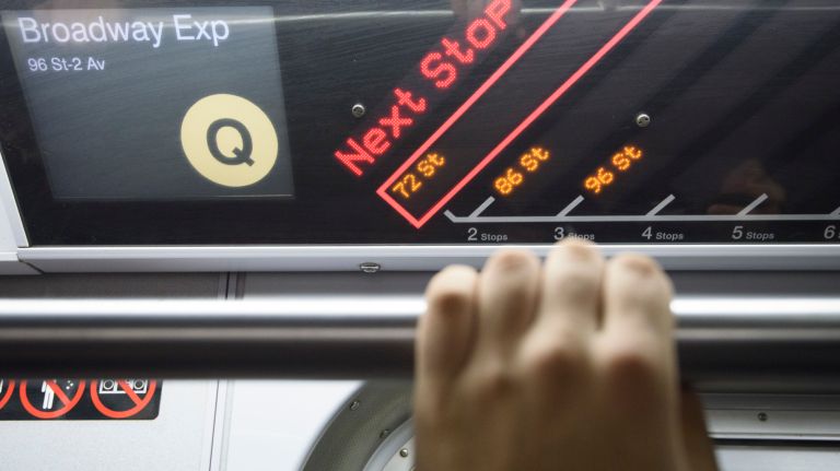 Passengers ride a northbound Q train during the first day of service on the Second Avenue subway on Sunday, Jan. 1, 2017.